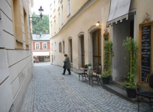 A very steep street with shops and cafe